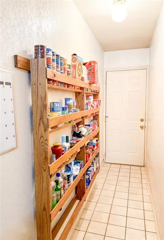 a bathroom with a tub sink and a chandelier