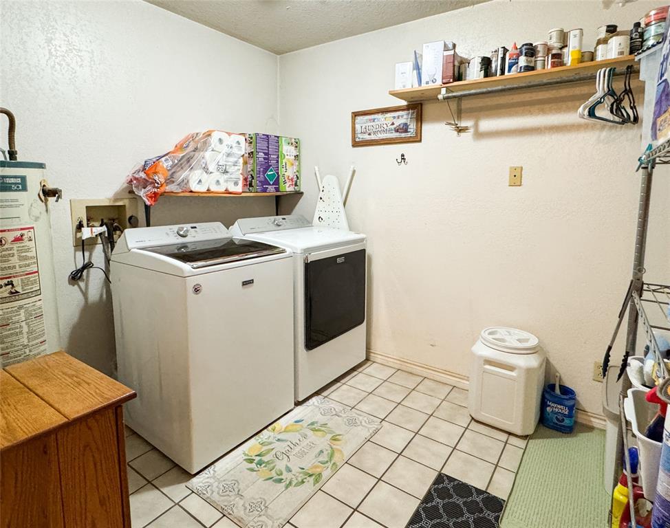 801 Highway 2214 Ranger, TX 76470 - Photo 17 of 40 a utility room with dryer and washer