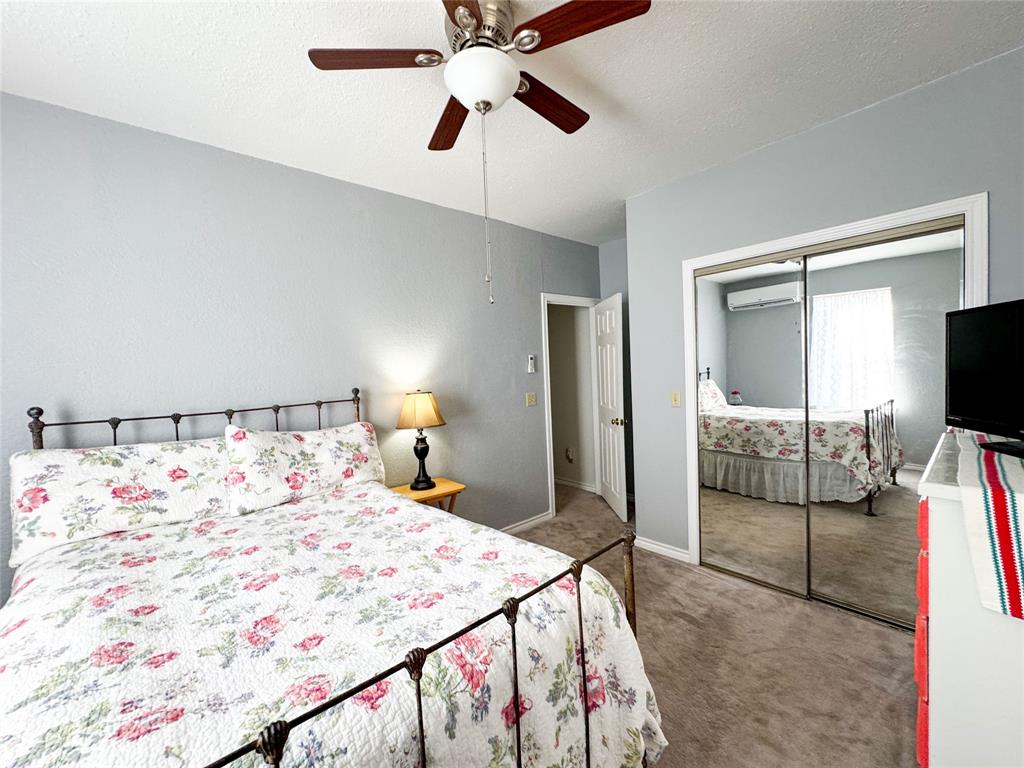 801 Highway 2214 Ranger, TX 76470 - Photo 19 of 40 a bedroom with a bed and a flat screen tv