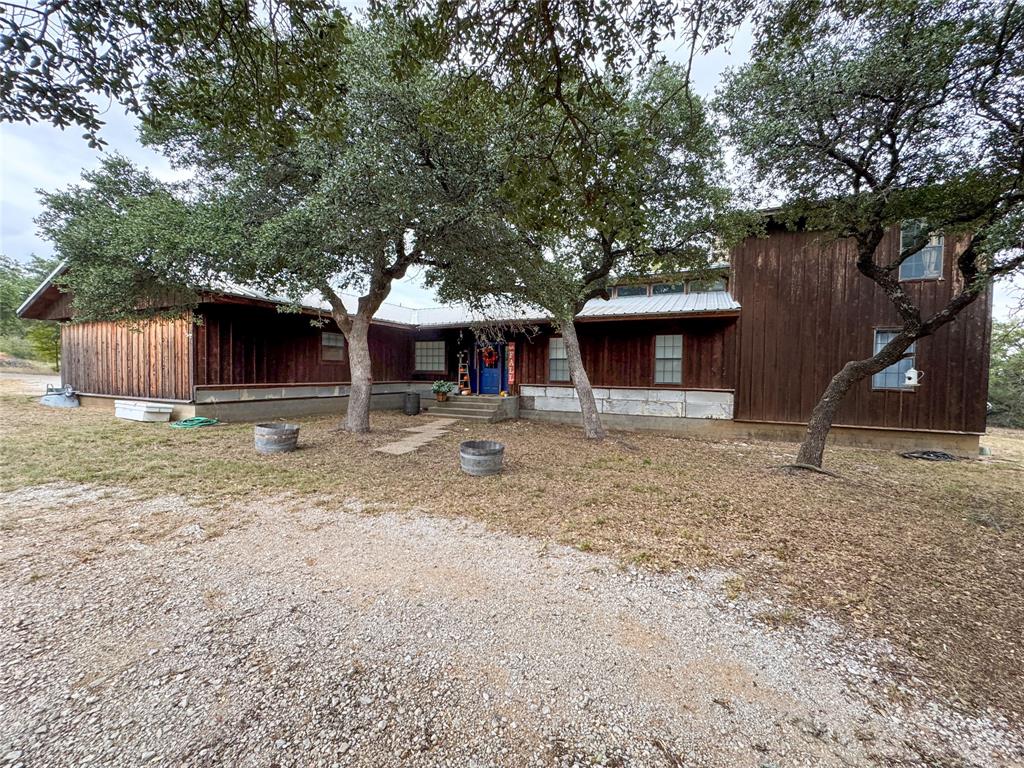 801 Highway 2214 Ranger, TX 76470 - Photo 2 of 40 a front view of a house with garden