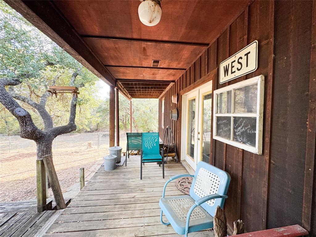801 Highway 2214 Ranger, TX 76470 - Photo 30 of 40 a view of a porch with furniture and wooden floor