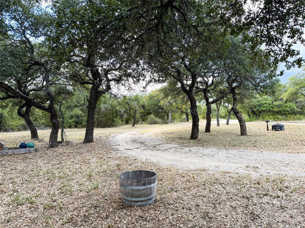 801 Highway 2214 Ranger, TX 76470 - Photo 37 of 40 a backyard of a house with large trees