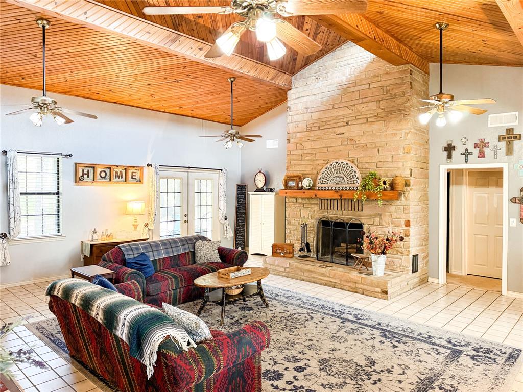 801 Highway 2214 Ranger, TX 76470 - Photo 5 of 40 a living room with furniture a fireplace and a table