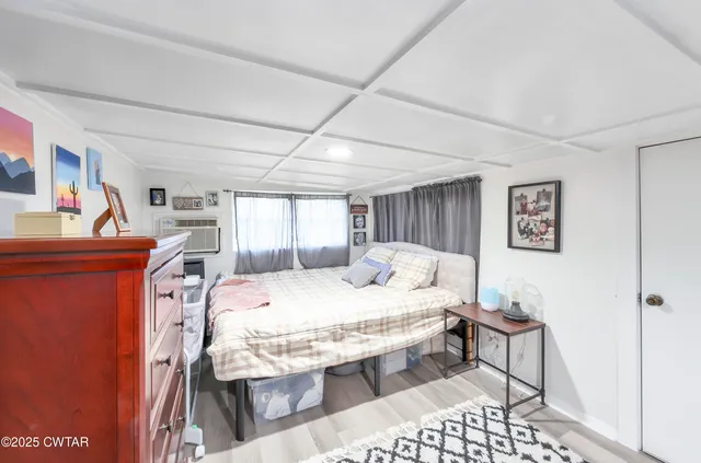 a bedroom with a bed and a table