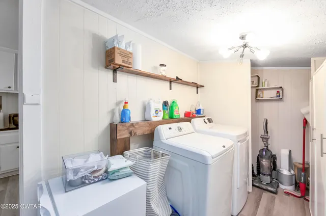 a utility room with sink dryer and washer
