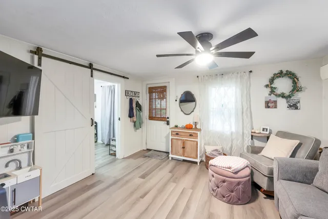 a living room with furniture and a window