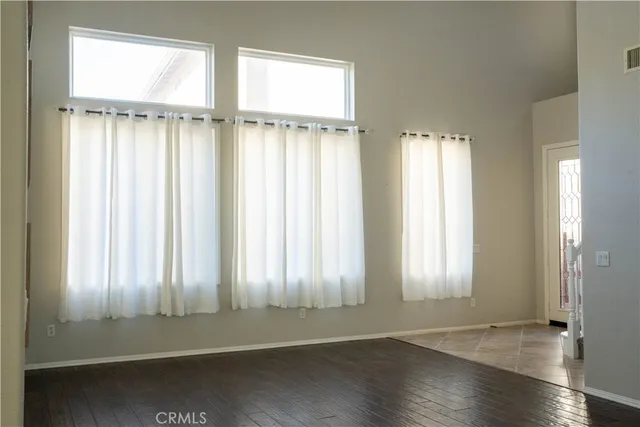 a view of an entryway with wooden floor