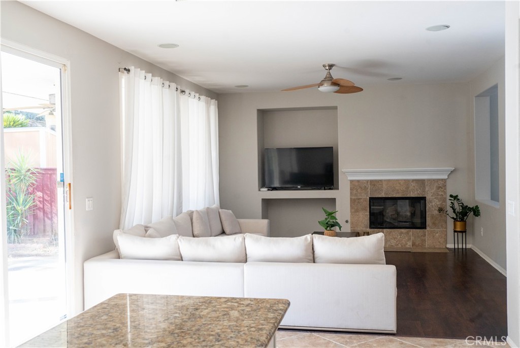 36719 Torrey Pines Drive Beaumont, CA 92223 - Photo 28 of 56 a living room with furniture and a fireplace