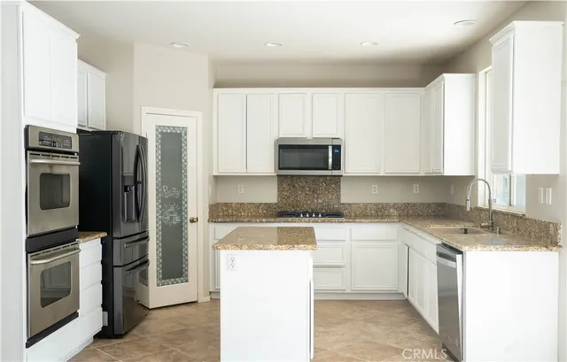 a room with a workspace and a window