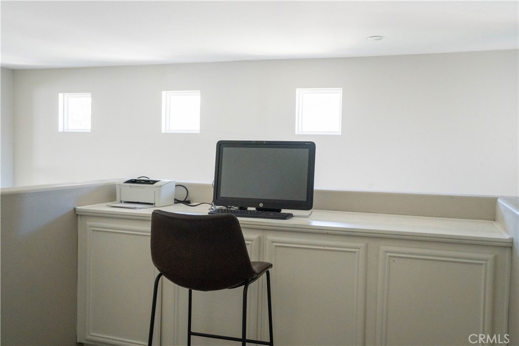 36719 Torrey Pines Drive Beaumont, CA 92223 - Photo 35 of 56 a room with a workspace and a window