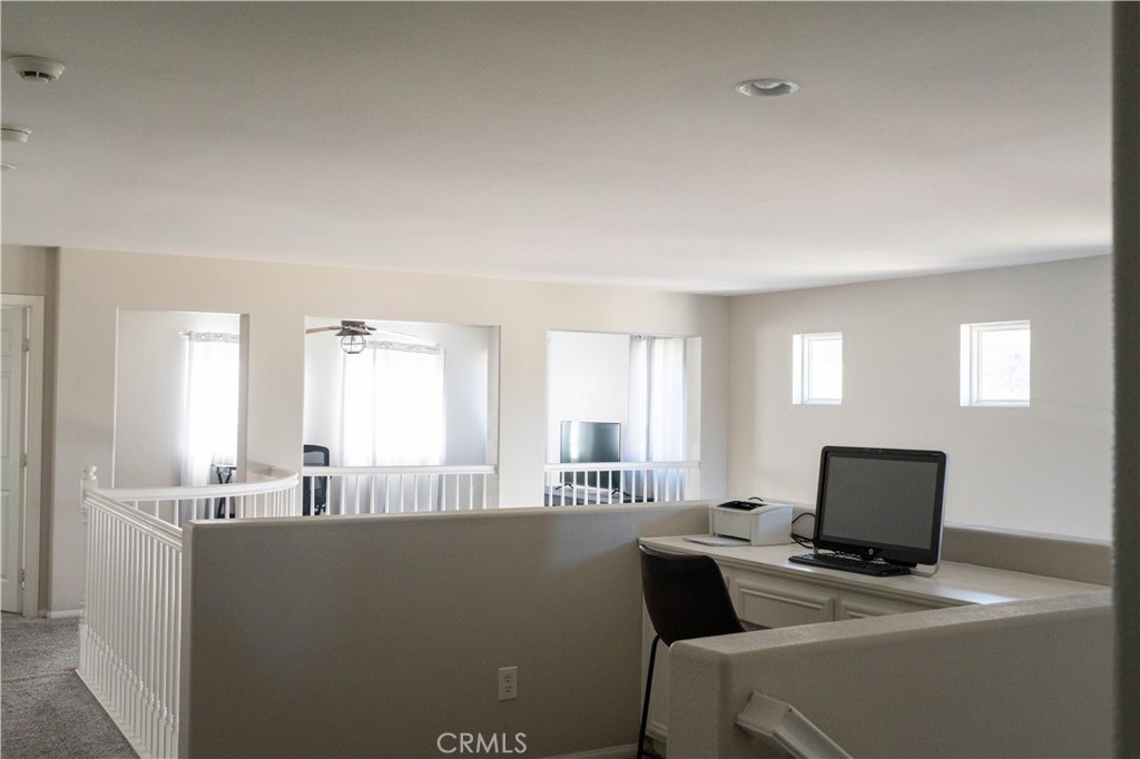 36719 Torrey Pines Drive Beaumont, CA 92223 - Photo 36 of 56 a living room with furniture and a flat screen tv