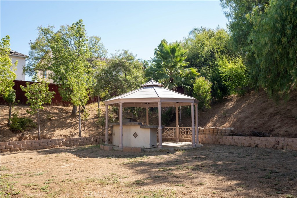 36719 Torrey Pines Drive Beaumont, CA 92223 - Photo 55 of 56 a view of a house with a yard and sitting area