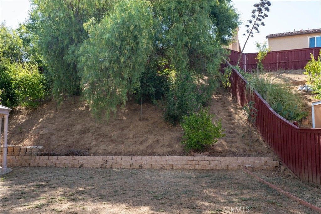 36719 Torrey Pines Drive Beaumont, CA 92223 - Photo 56 of 56 a view of a pathway with a wrought fence