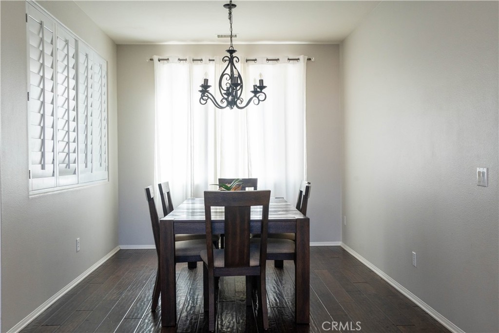 36719 Torrey Pines Drive Beaumont, CA 92223 - Photo 8 of 56 a view of a dining room with furniture window and outside view