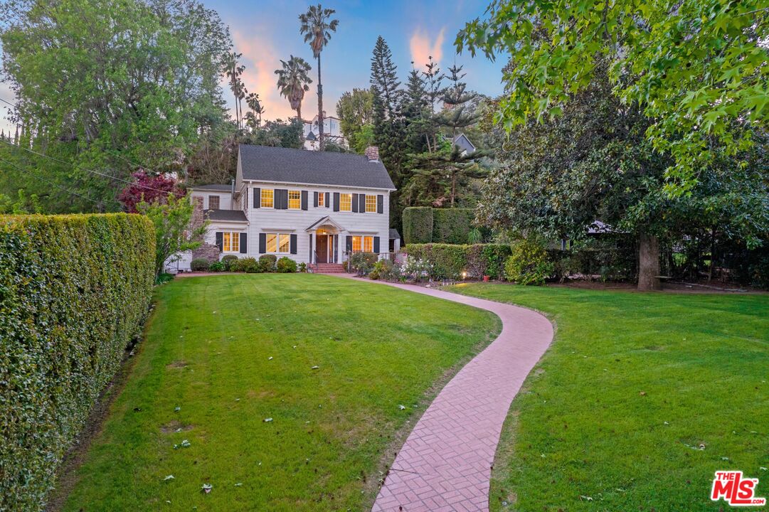 2429 North Commonwealth Avenue Los Angeles, CA 90027 - Photo 1 of 54 a front view of a house with a yard table and chairs