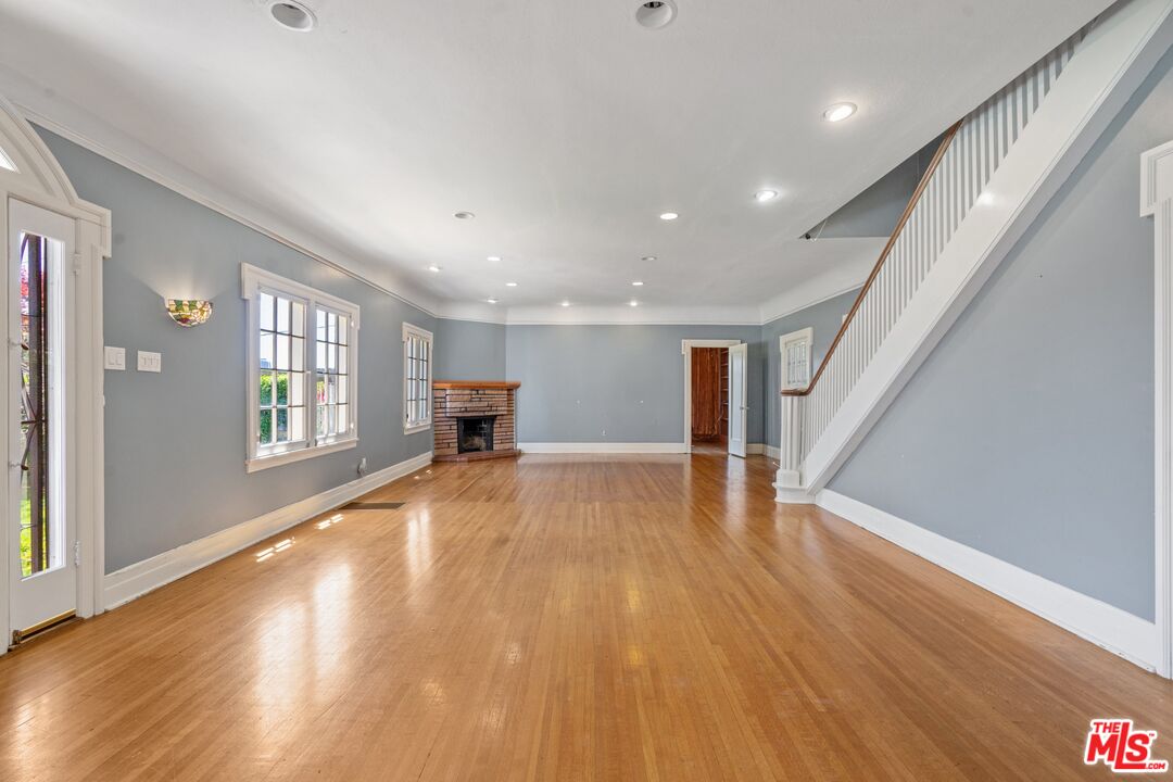 2429 North Commonwealth Avenue Los Angeles, CA 90027 - Photo 12 of 54 a view of empty room with wooden floor and window