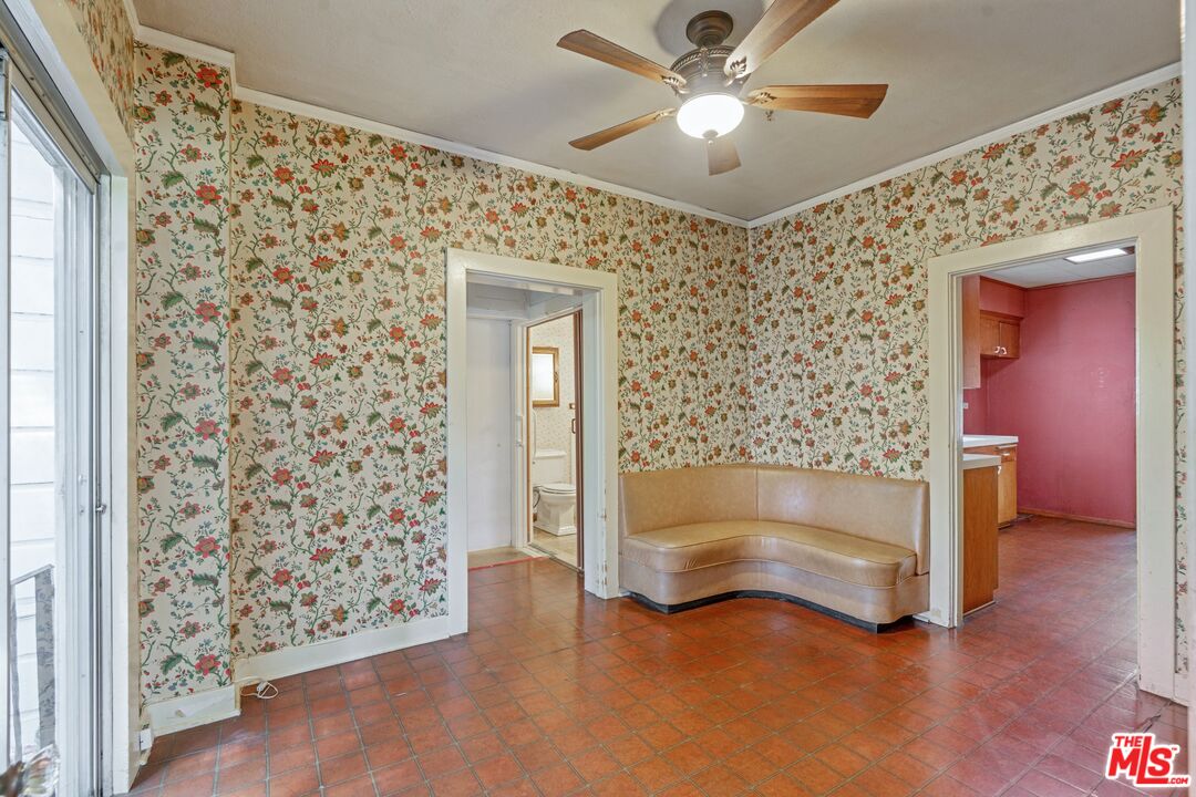 2429 North Commonwealth Avenue Los Angeles, CA 90027 - Photo 22 of 54 a view of an empty room and window with wooden floor