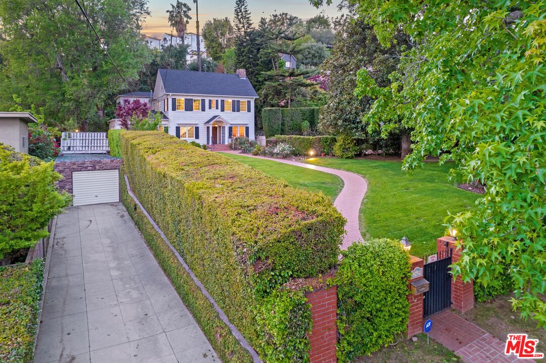 2429 North Commonwealth Avenue Los Angeles, CA 90027 - Photo 3 of 54 a view of a house with a yard and fountain in middle of the house