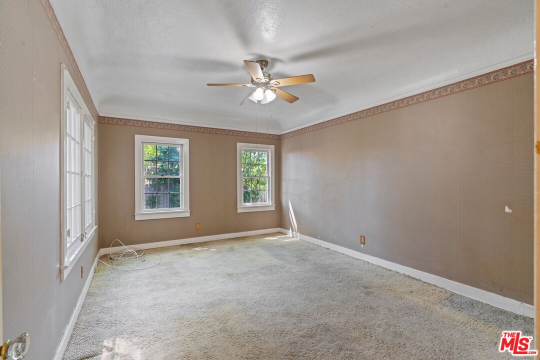 2429 North Commonwealth Avenue Los Angeles, CA 90027 - Photo 31 of 54 wooden floor in an empty room with a window