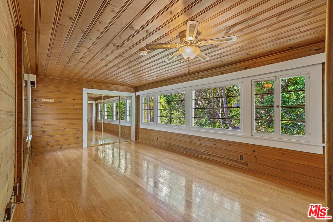 2429 North Commonwealth Avenue Los Angeles, CA 90027 - Photo 35 of 54 a view of empty room with wooden floor and fan