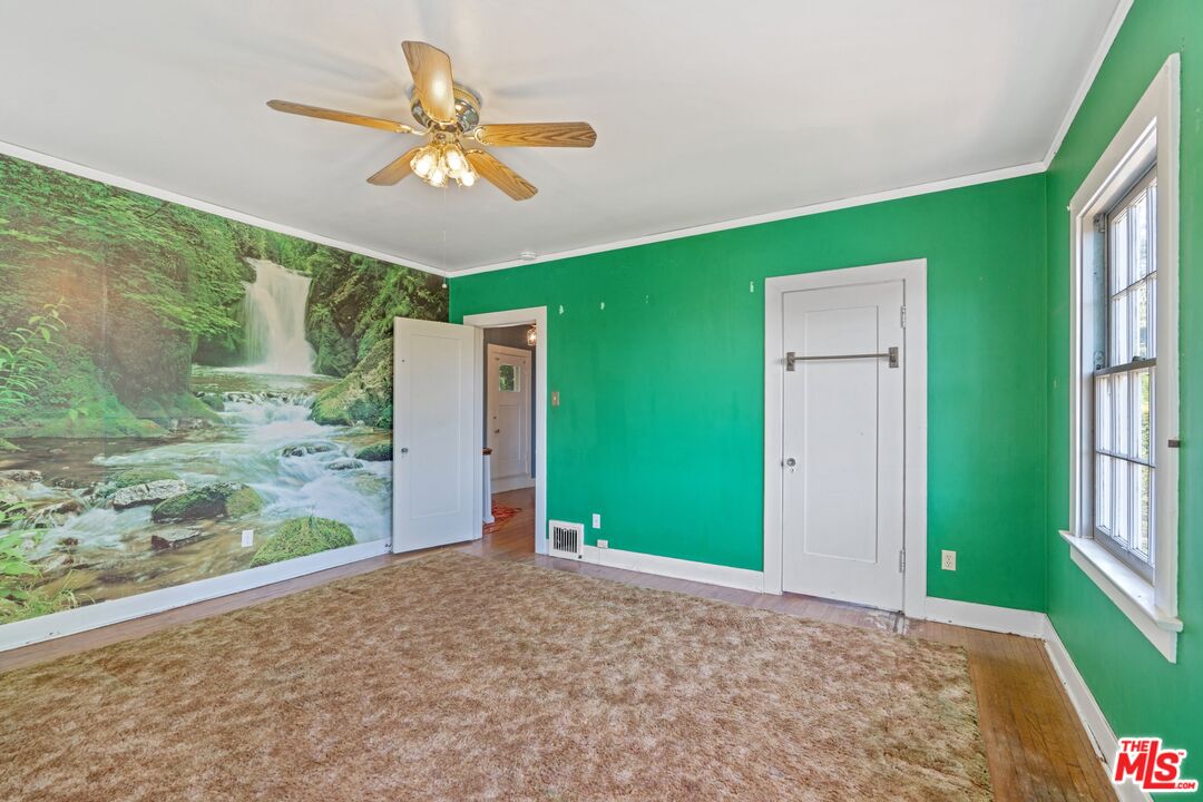 2429 North Commonwealth Avenue Los Angeles, CA 90027 - Photo 42 of 54 a view of a livingroom with a ceiling fan and window