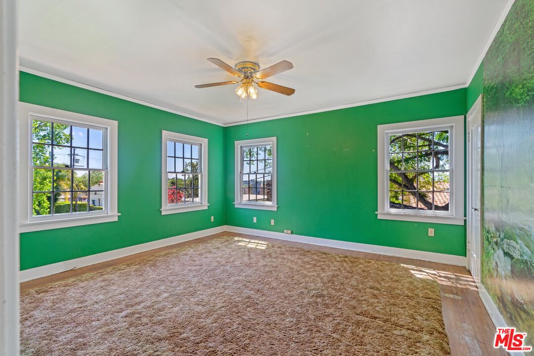 2429 North Commonwealth Avenue Los Angeles, CA 90027 - Photo 43 of 54 a view of room with window and ceiling fan