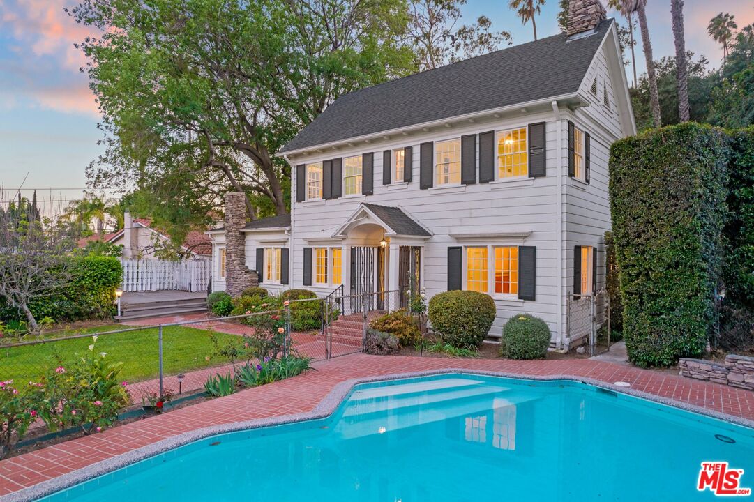 2429 North Commonwealth Avenue Los Angeles, CA 90027 - Photo 5 of 54 a front view of a house with a yard