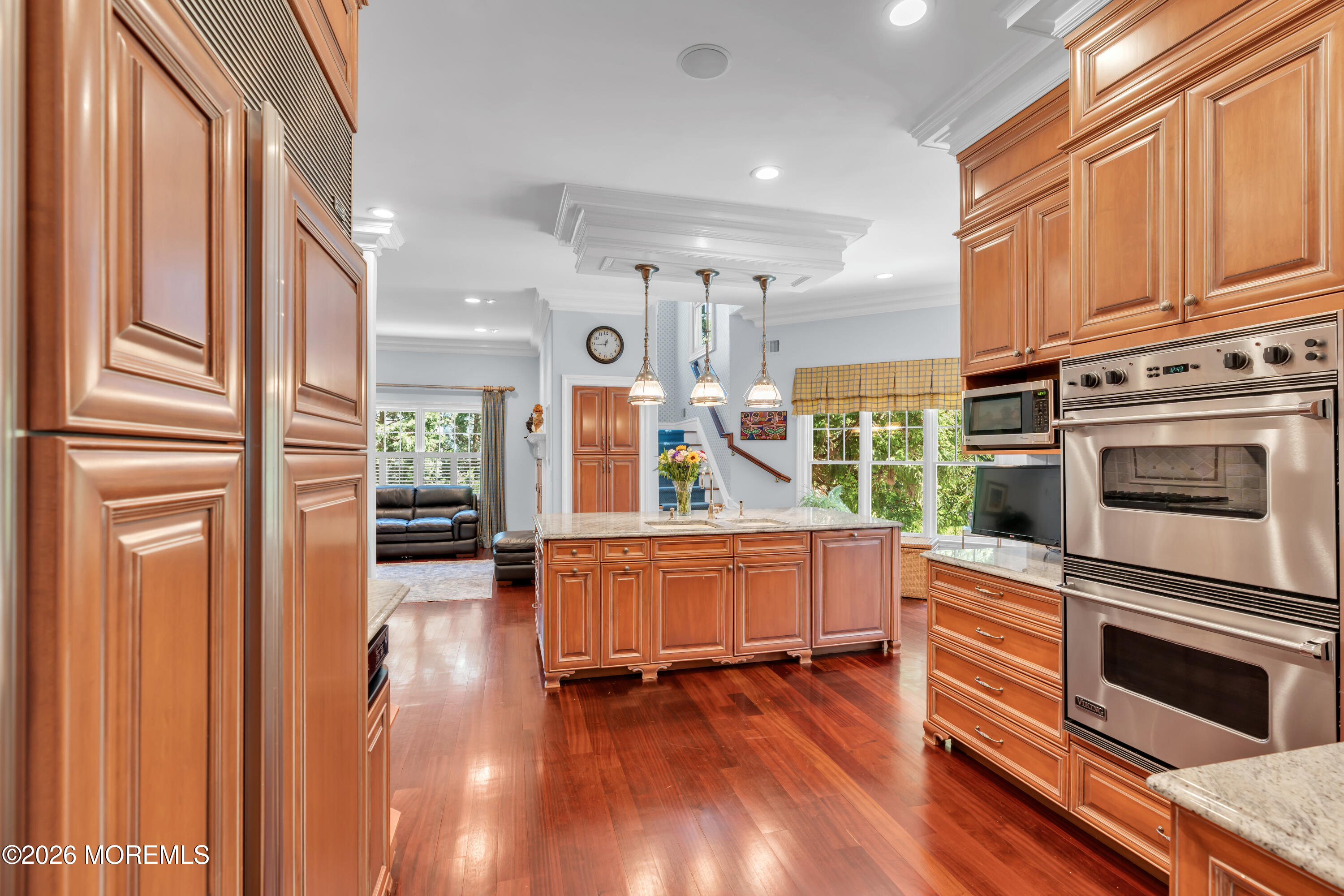 600 Little Silver Point Road Little Silver, NJ 07739 - Photo 17 of 55 a kitchen with stainless steel appliances a stove top oven and wooden floors