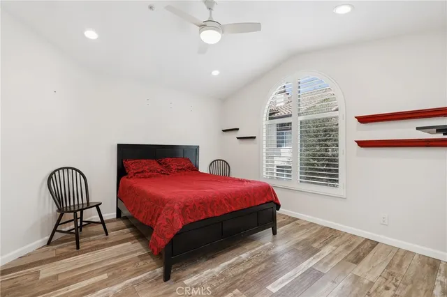 a bed room with a bed and a chair