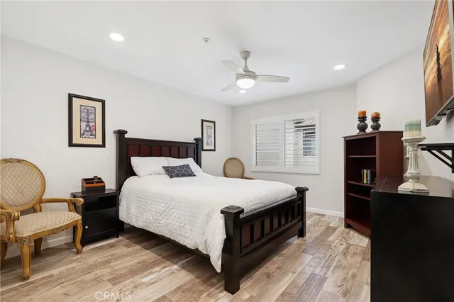 a bedroom with a bed and a table in it