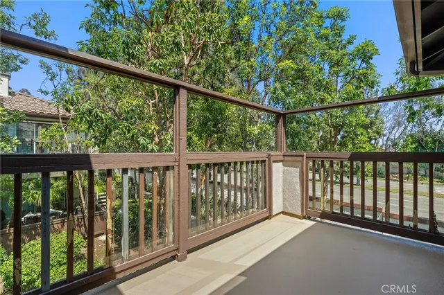 a view of a balcony with wooden floor