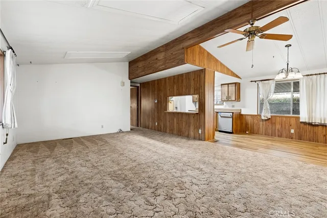 a view of a livingroom with wooden floor and a window