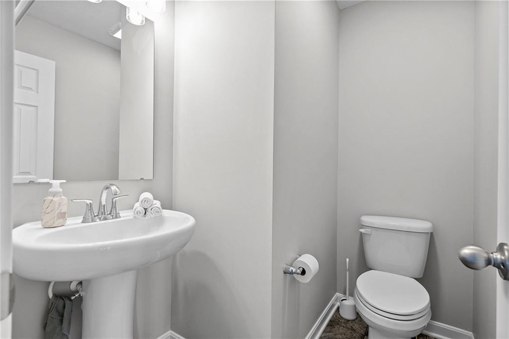 264 Lily Ridge Drive Canonsburg, PA 15317 - Photo 24 of 50 a bathroom with a toilet sink and mirror