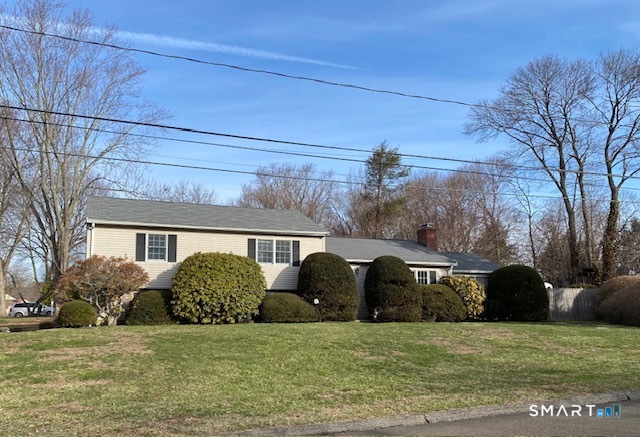 a view of a house with a backyard