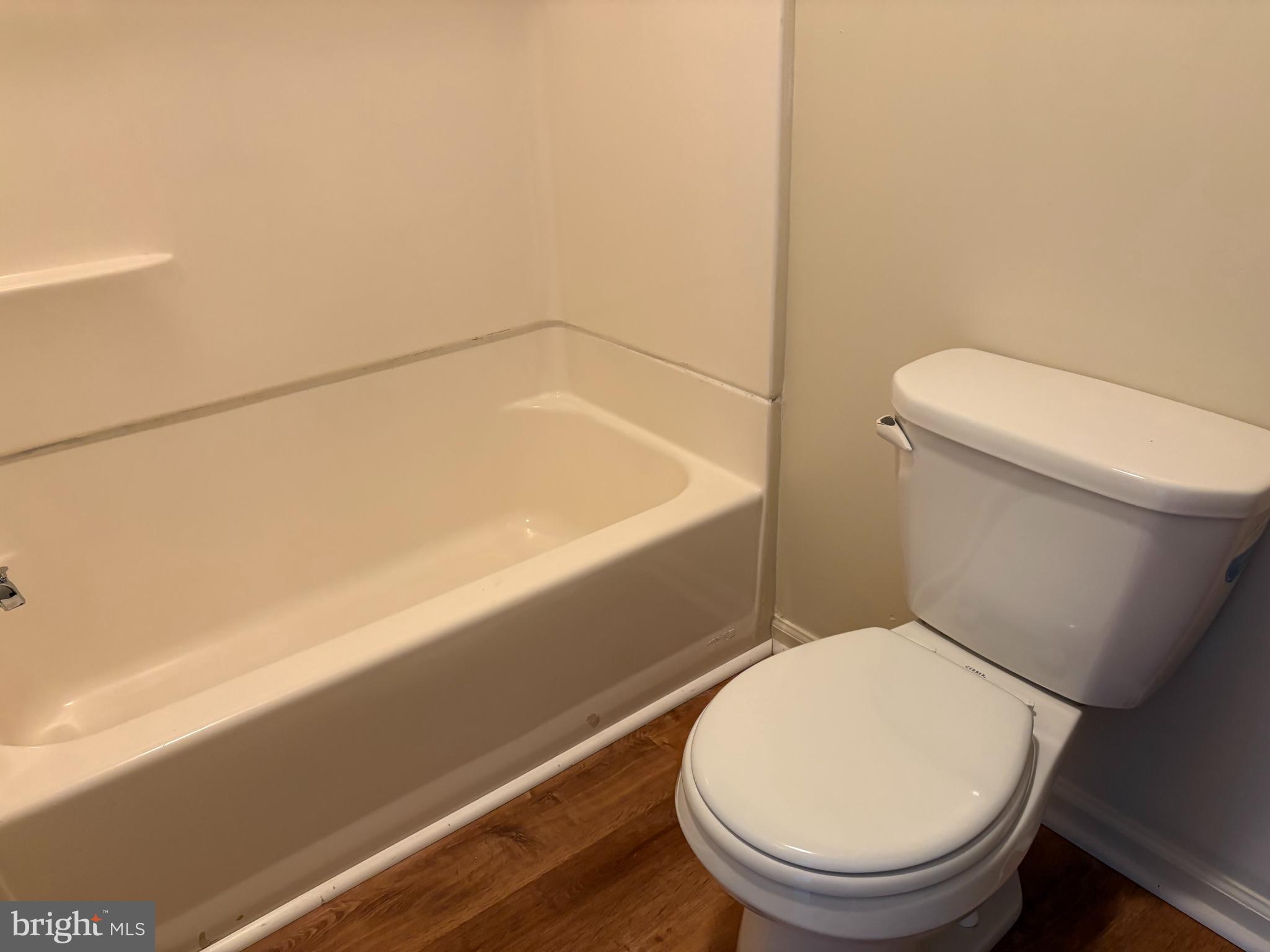 330 East Chestnut Street Coatesville, PA 19320 - Photo 11 of 17 a bathroom with a toilet and a bathtub
