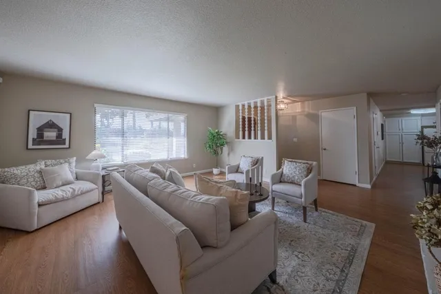 a living room with furniture and a large window