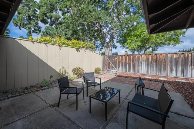 a view of table and chairs in patio