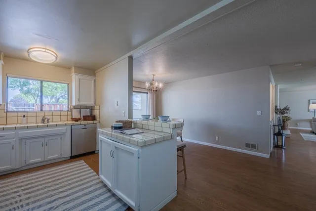 a kitchen with a stove a sink and a refrigerator