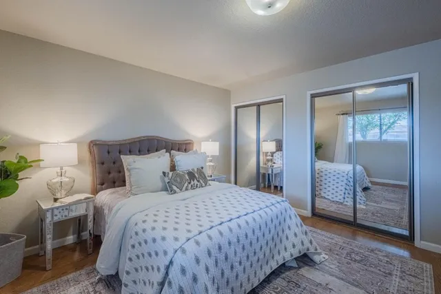 a bedroom with a bed and a couch