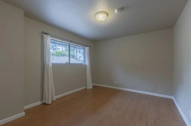 a view of an empty room and window