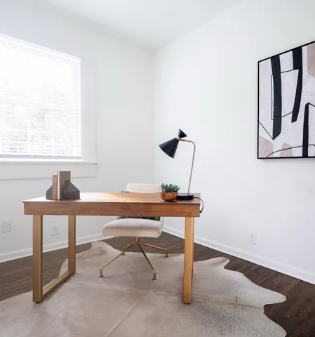 a view of a room with a table and a window
