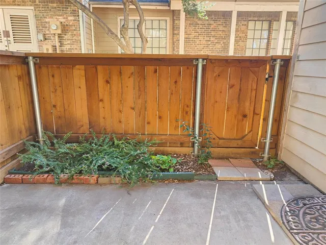 a view of a door with wooden fence