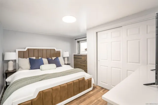 a bedroom with a bed and a couch