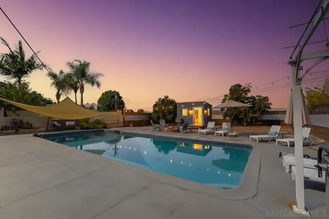 a view of a swimming pool with a lounge chairs