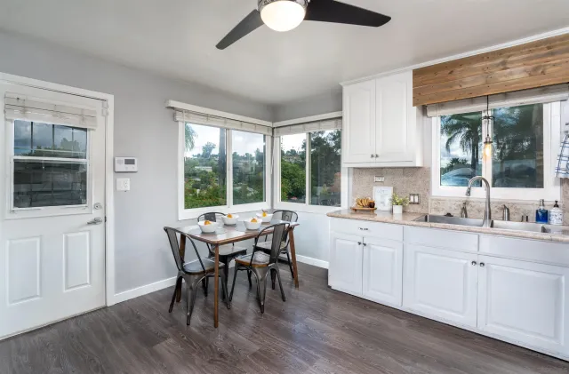 a view of a dining room with furniture window and outside view