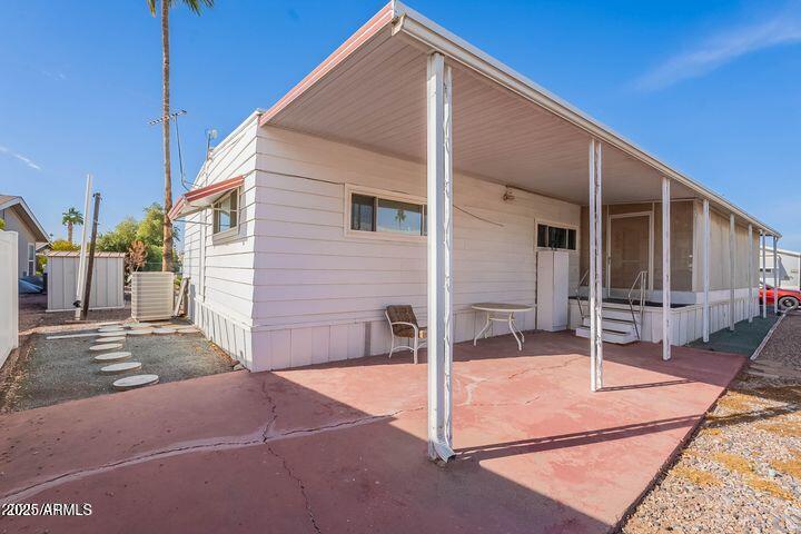 201 South Greenfield Road, Unit 142 Mesa, AZ 85206 - Photo 10 of 53 a backyard of a house with seating space