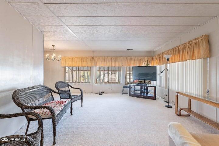 201 South Greenfield Road, Unit 142 Mesa, AZ 85206 - Photo 16 of 53 a living room with furniture and a flat screen tv