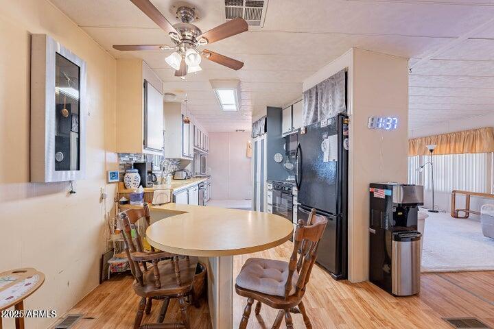 201 South Greenfield Road, Unit 142 Mesa, AZ 85206 - Photo 24 of 53 a view of a dining room with furniture and wooden floor