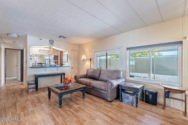 201 South Greenfield Road, Unit 142 Mesa, AZ 85206 - Photo 25 of 53 a living room with furniture a table and a large window