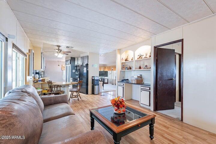 201 South Greenfield Road, Unit 142 Mesa, AZ 85206 - Photo 27 of 53 a living room with furniture and a table